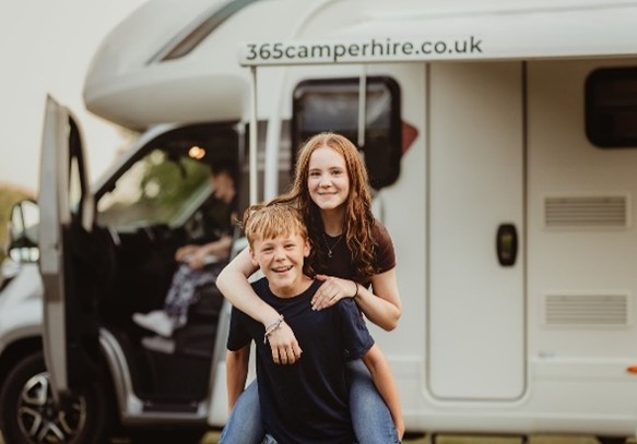 Children Enjoying Motorhome Life | 365Camperhire.co.uk Children playing outside Motorhome from 365 Camper Hire Hampshire